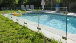 Residential swimming pool protected by a safety fence to help prevent accidents and improve home safety