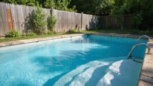 Modern pool fence upgrade around a backyard swimming pool